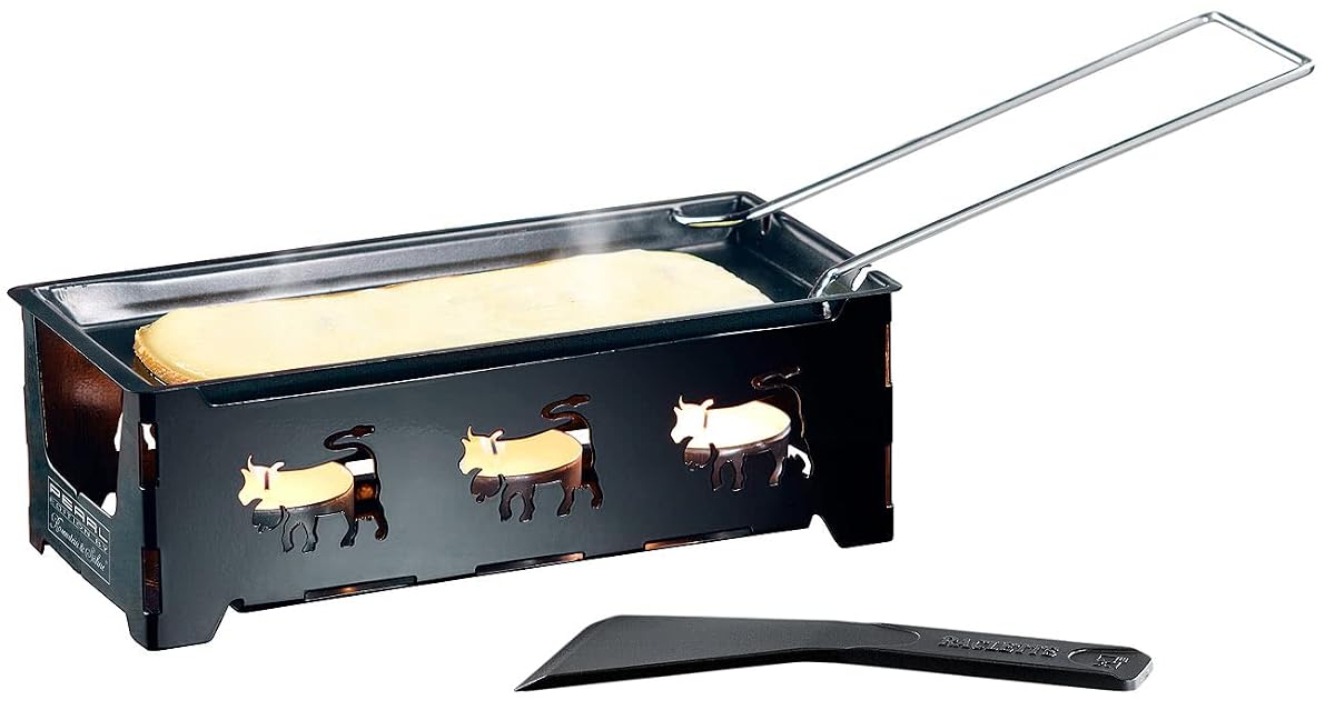 Appareil à raclette pliable en métal noir avec trois bougies, grattoir et fromage fondu