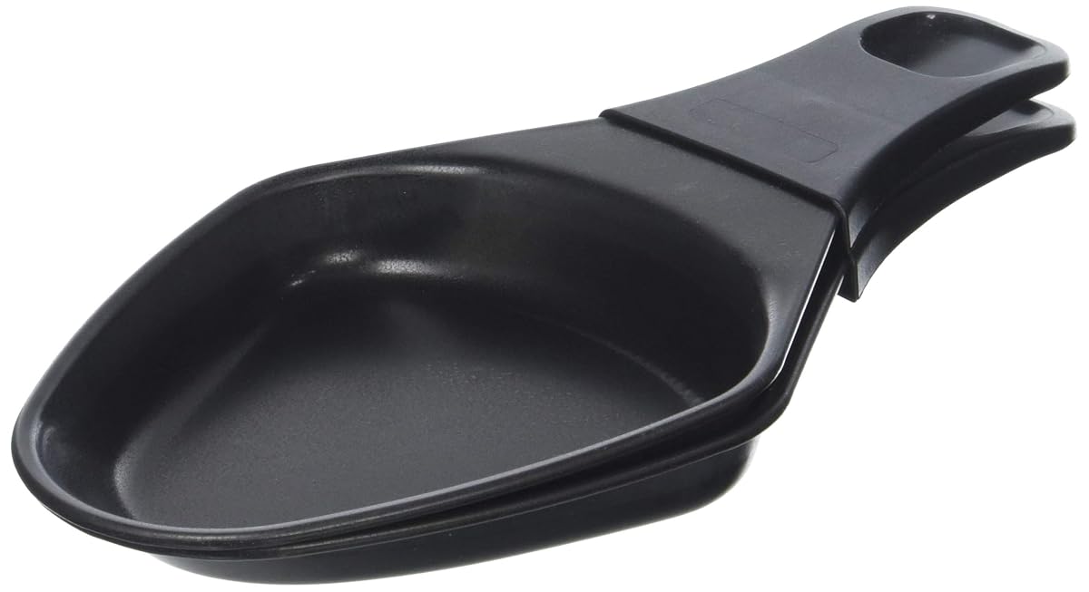 Deux coupelles ovales noires Tefal pour raclette, dont une garnie de fromage fondu